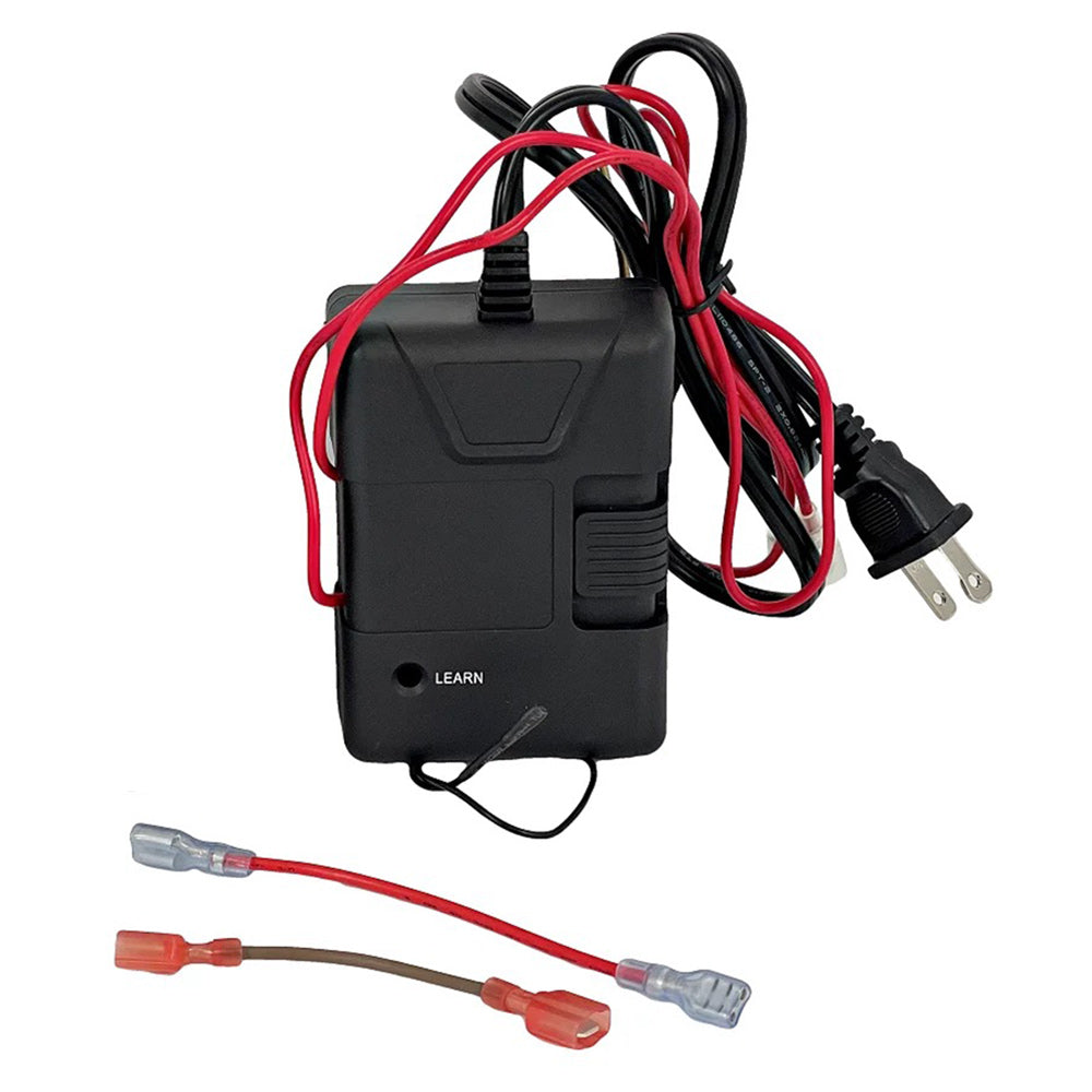 Black receiver box with learn button, multiple wired connectors and plugs
