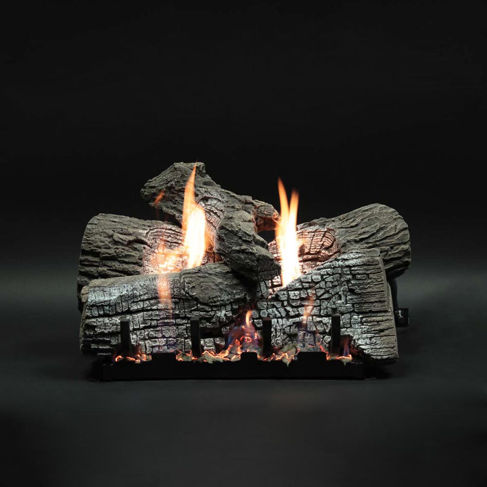 Stacked refractory gas log set with faux wildwood logs and visible flames
