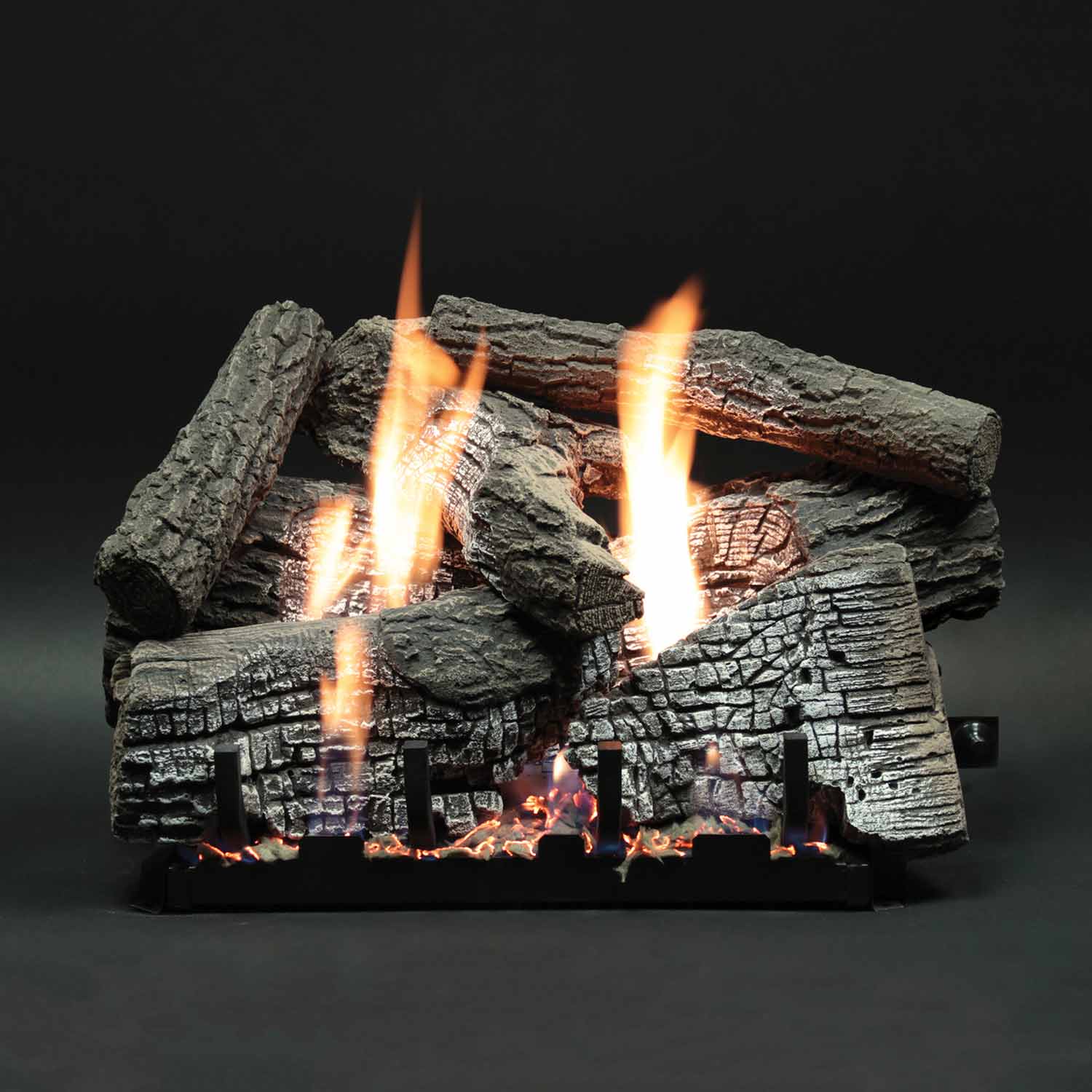 Fireplace log set with refractory log pieces and tall flames rising between logs