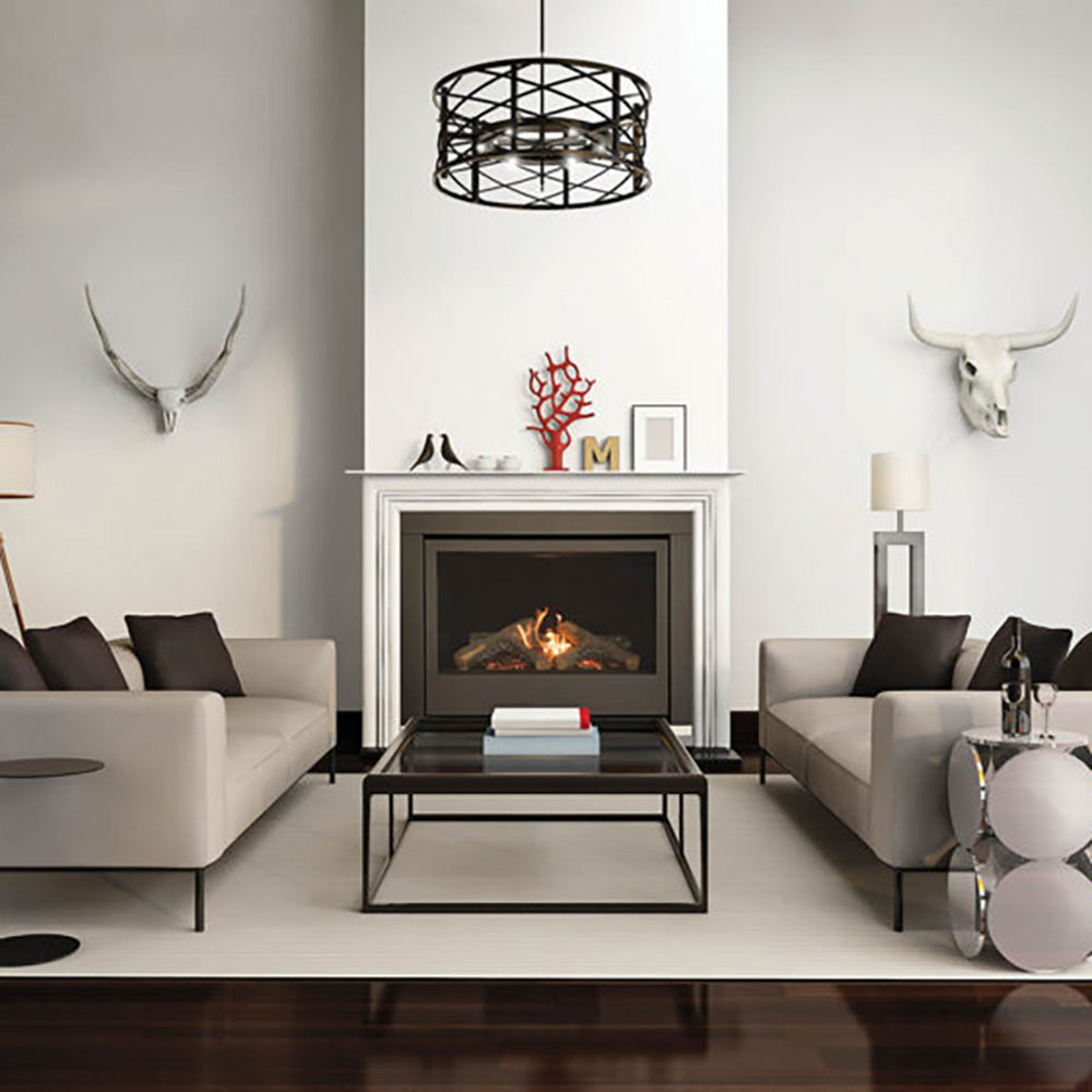 Built-in gas fireplace with log set, black frame, and stone surround