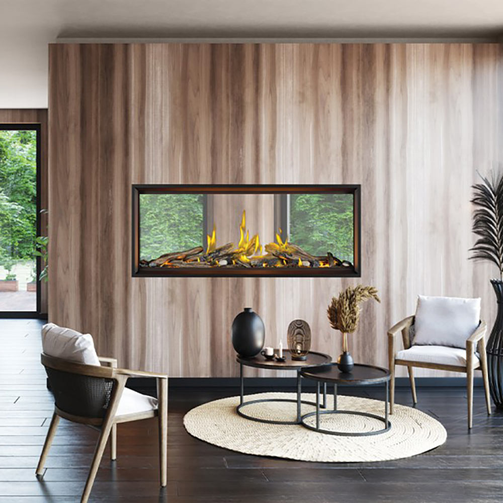Linear see-through gas fireplace with glowing yellow flames and logs in dark surround