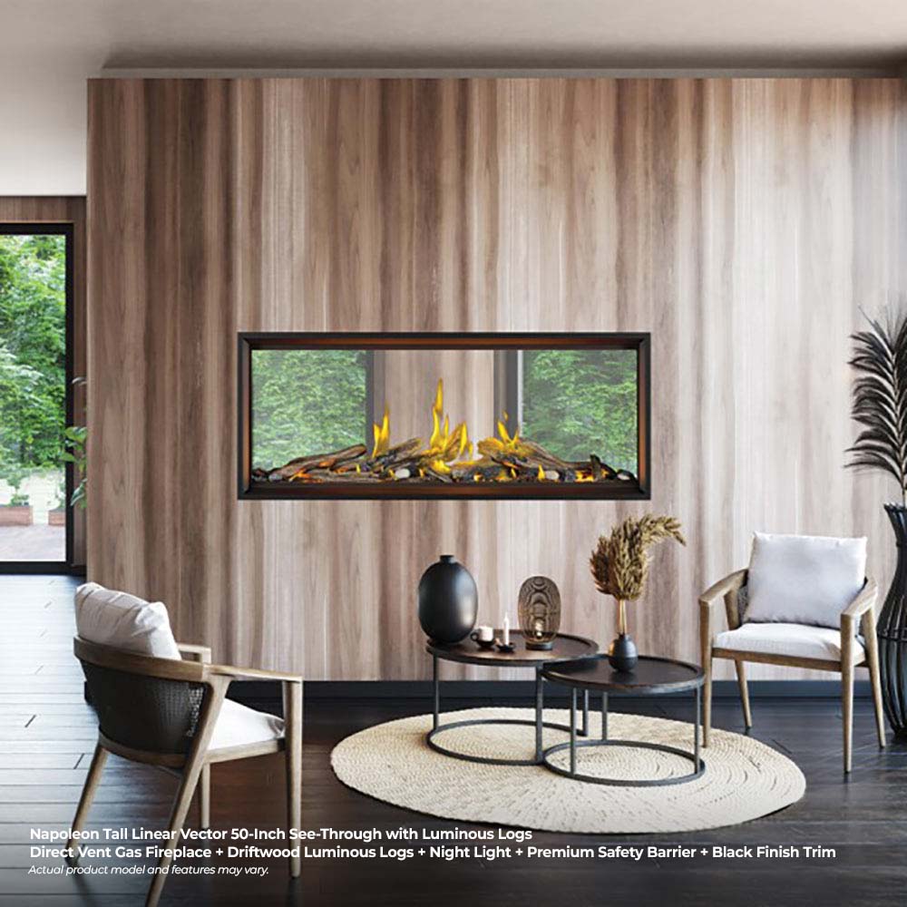 Tall linear see-through direct vent gas fireplace with luminous logs and black trim
