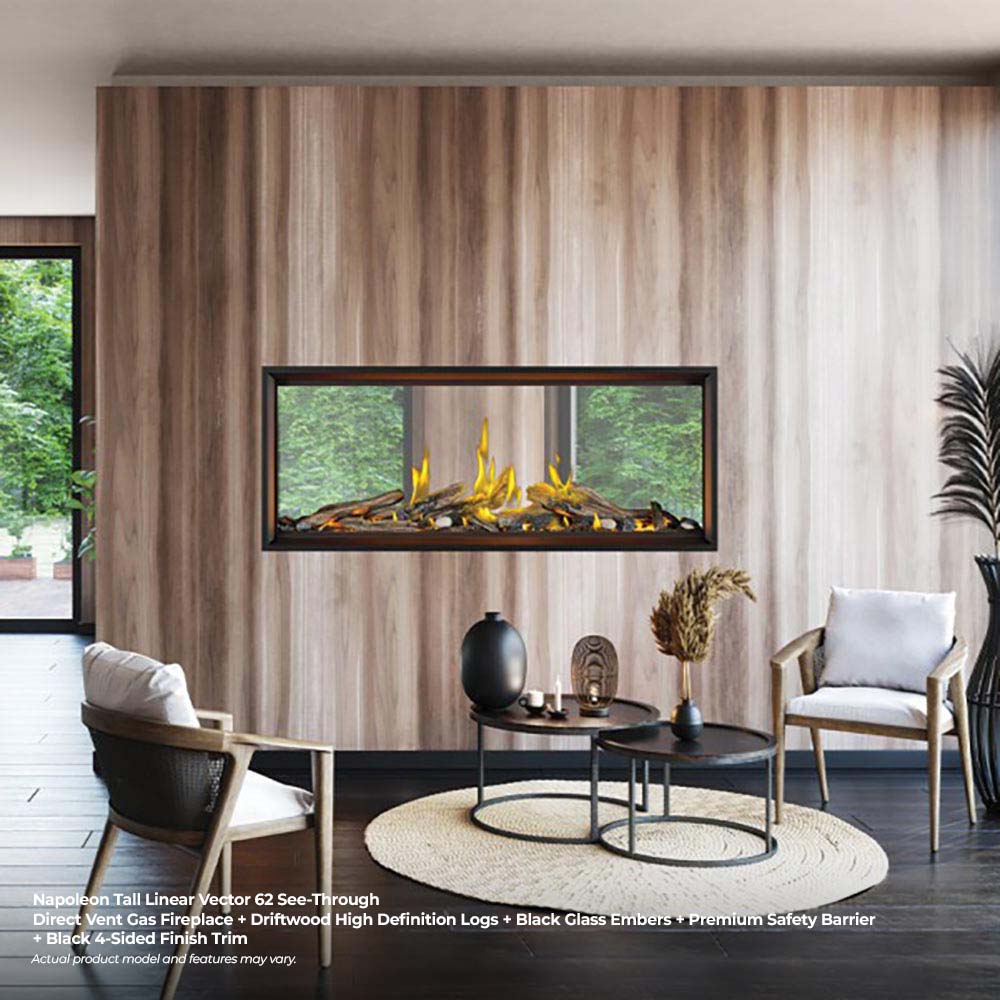 Tall linear direct vent gas fireplace with clear glass and glowing luminous logs