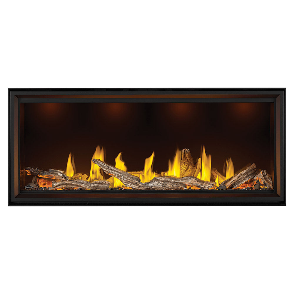 Linear direct vent gas fireplace with burning logs and bright flames