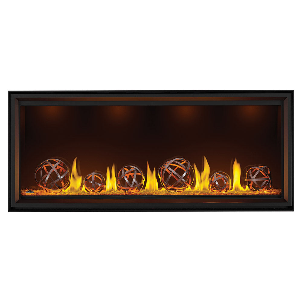 Black linear gas fireplace with burning logs and globe-style decor in the firebox