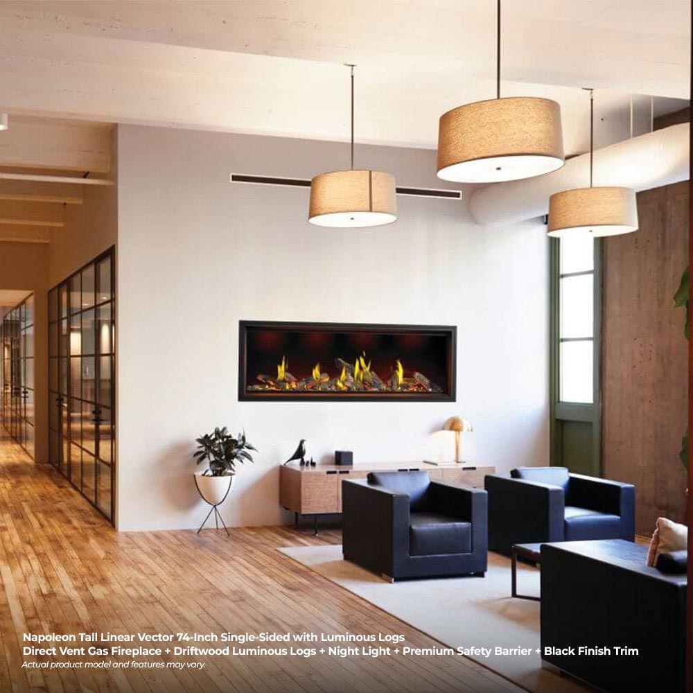 Linear gas fireplace with glowing log flames in a black frame on a white wall