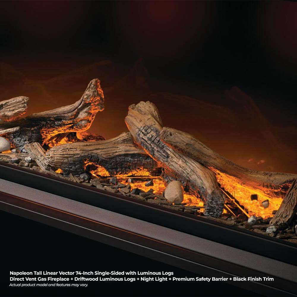 Close-up of luminous logs with orange flames inside a black-framed firebox