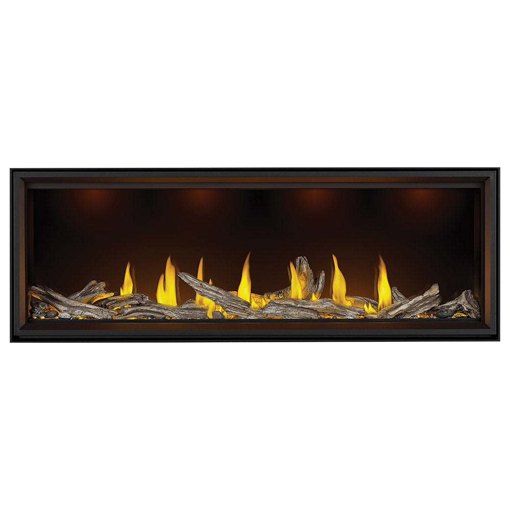 Black linear direct vent gas fireplace with bright flames over stacked log set