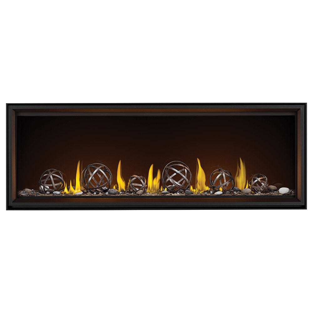Black linear direct vent gas fireplace with glowing flames and metal globe flame guards