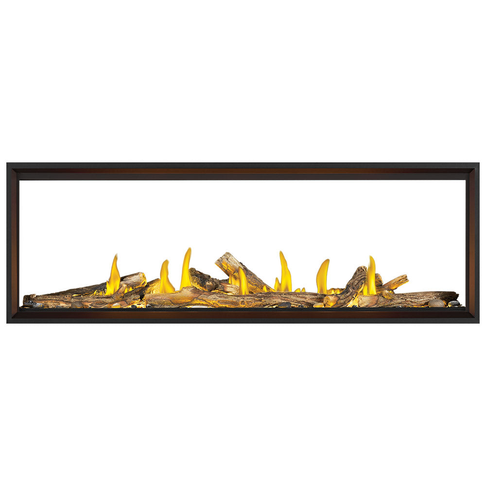 Linear see-through gas fireplace with dark frame and flames over log bed