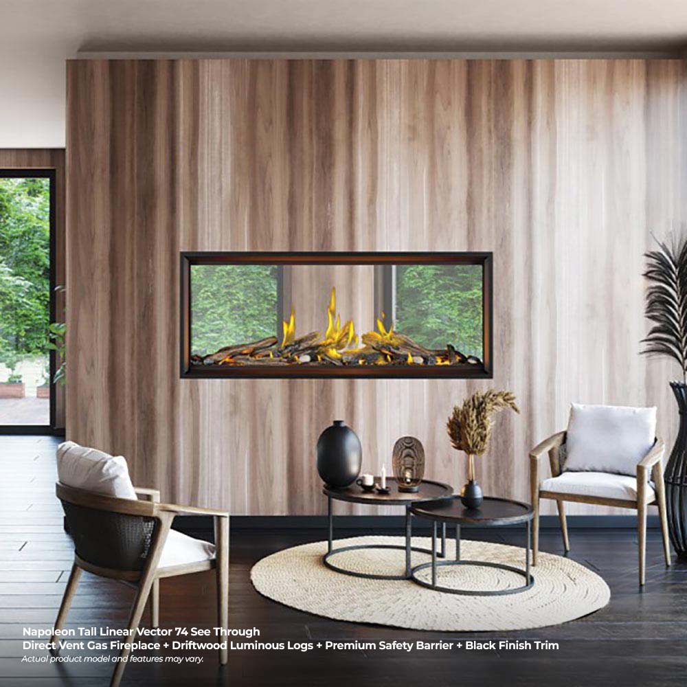 Linear see-through gas fireplace with glowing flames and log bed in a bright living space
