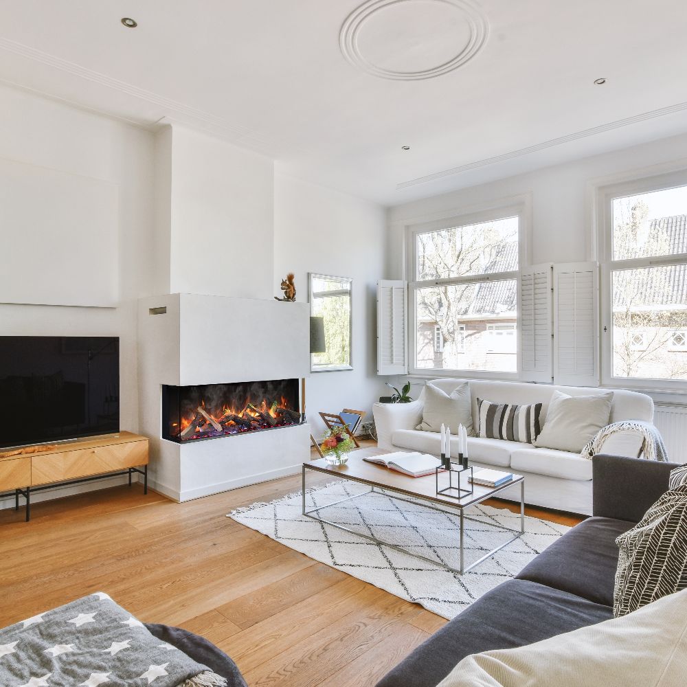 Built-in electric fireplace with orange flame effect and modern white wall surround
