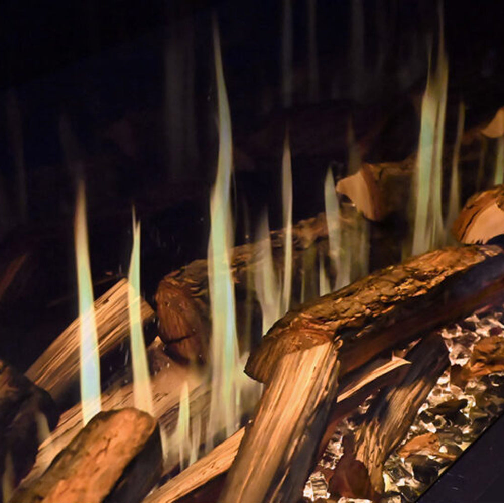 Timber log burner insert with vertical flames and glowing embers