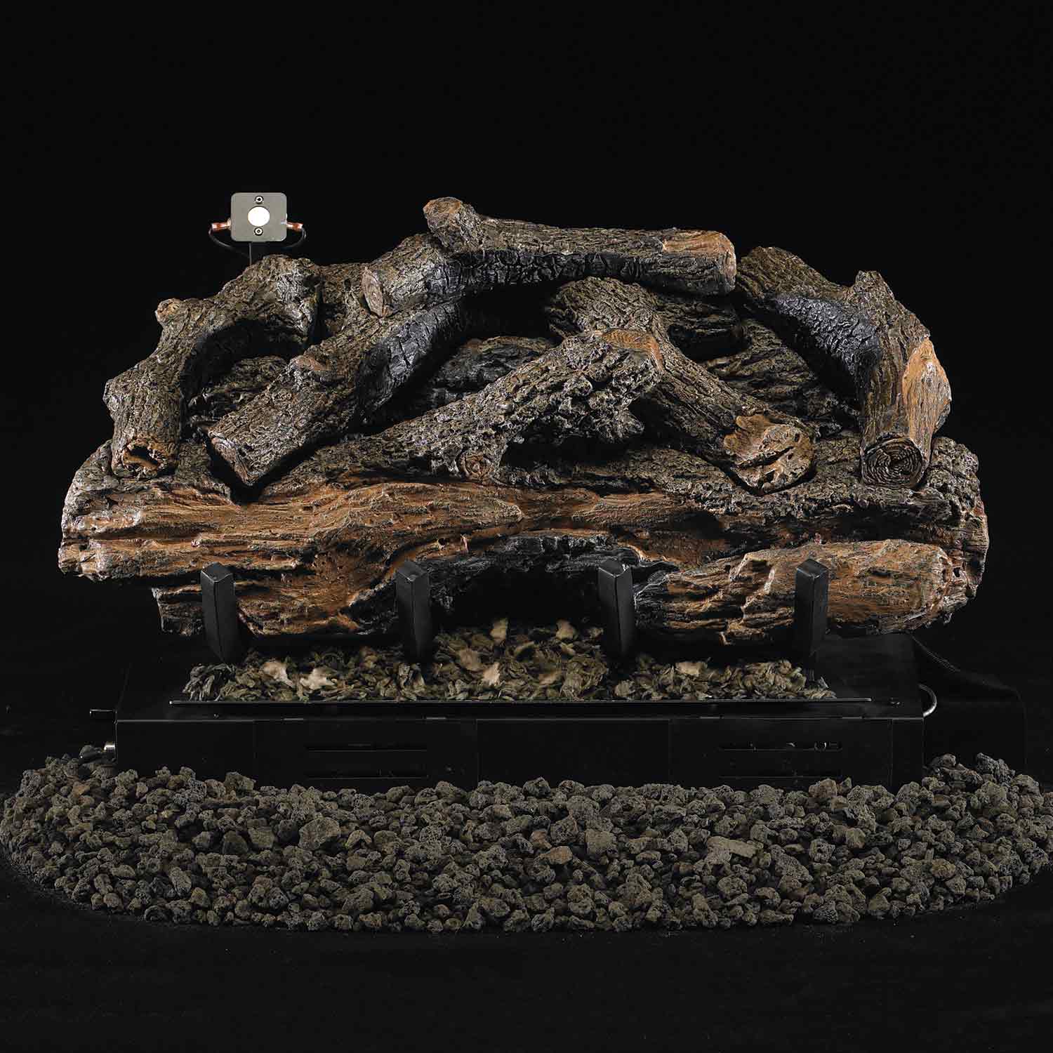 Charred aged ventless gas log set with dark logs and black base, no visible flames