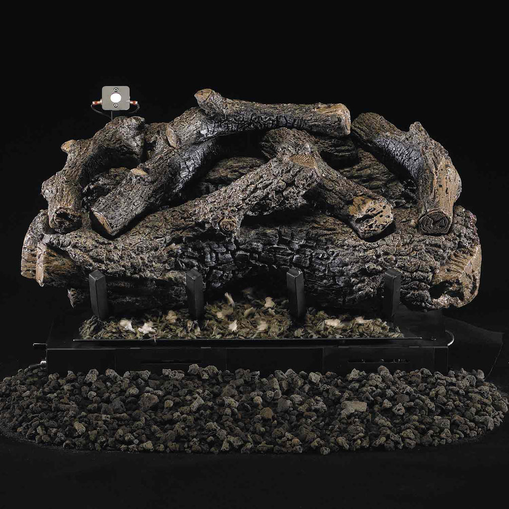 Charred oak ventless gas log set with dark firebox and ember base