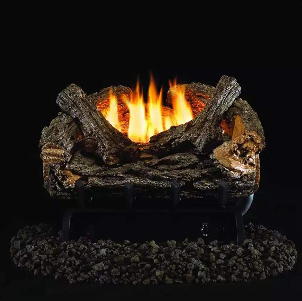 Ventless gas log set with burning flames in dark oak-style logs over charcoal bed
