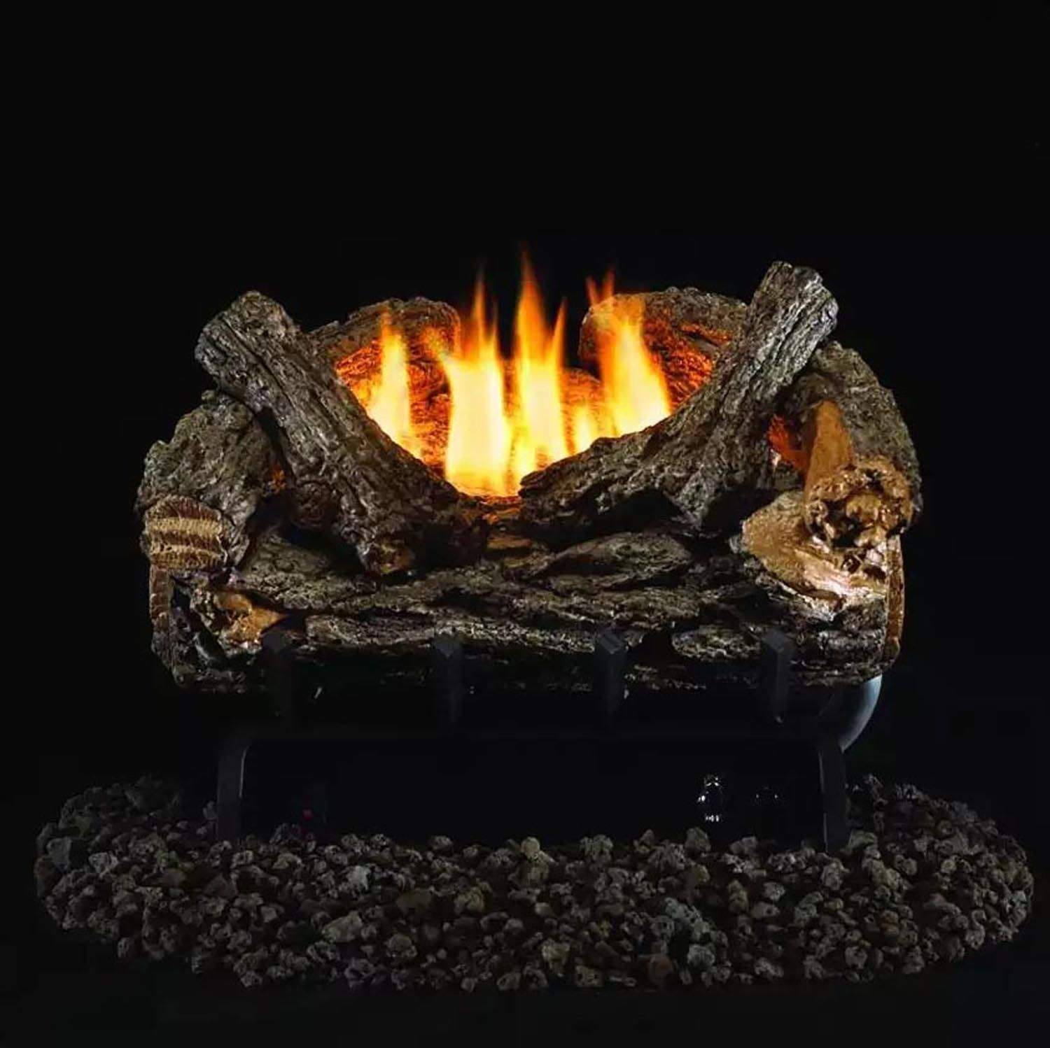 Ventless gas log set with burning flames in dark oak-style logs over charcoal bed