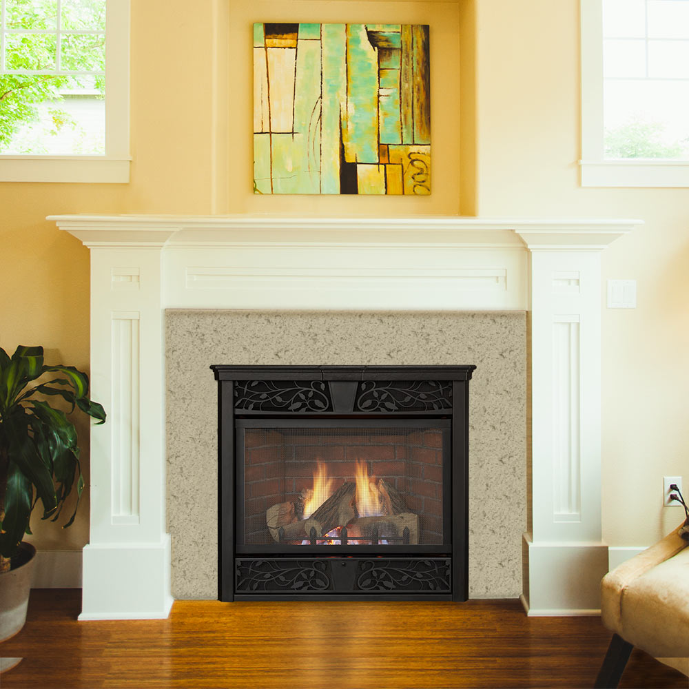 Black ventless gas fireplace in stone surround with burning log set behind glass