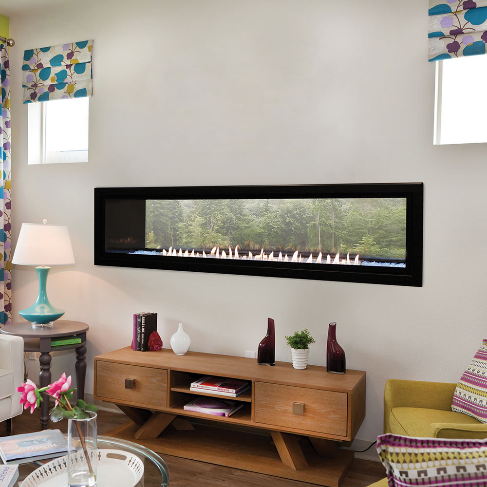 Black-framed linear ventless fireplace with glowing gas flames behind glass