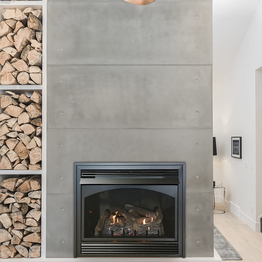 Ventless fireplace with black frame and glowing log set, built into gray surround
