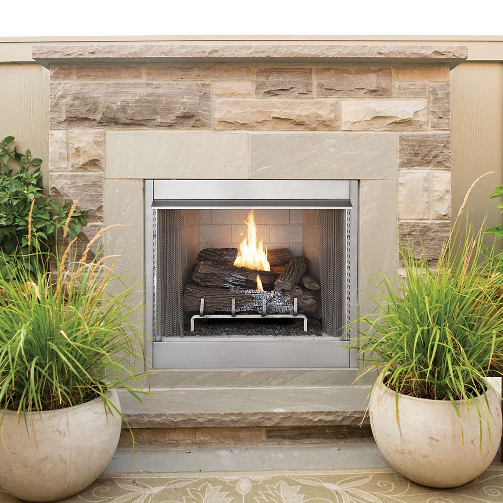 Outdoor vent-free firebox with glowing log set, framed in metal screen