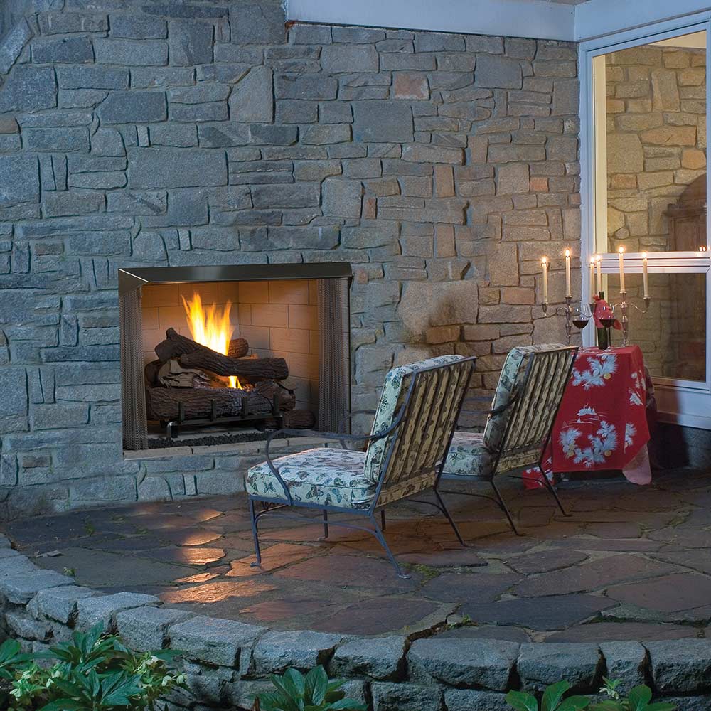 Outdoor vent-free firebox opening with flames and stacked gas logs