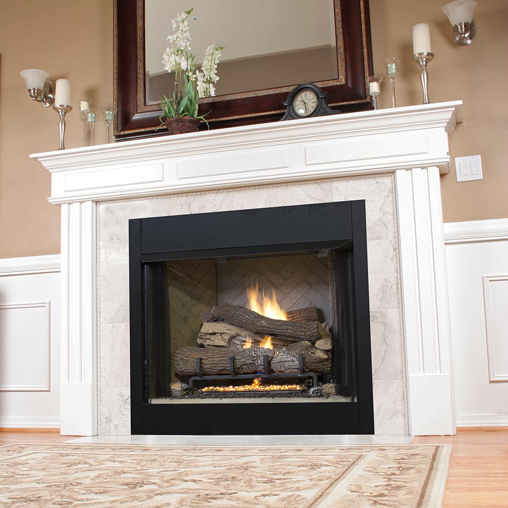 Black fireplace insert firebox with burning logs behind a mesh screen