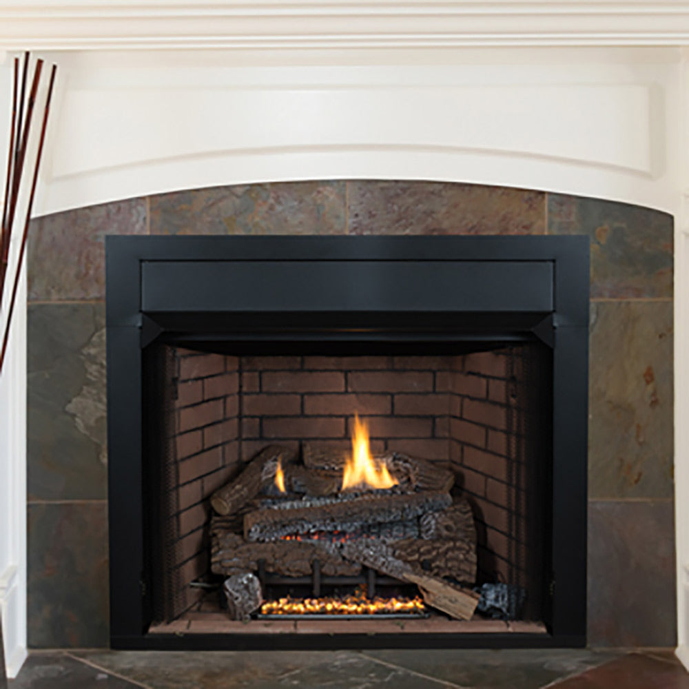 Vent-free gas fireplace with black frame and brick firebox, flames over concrete logs