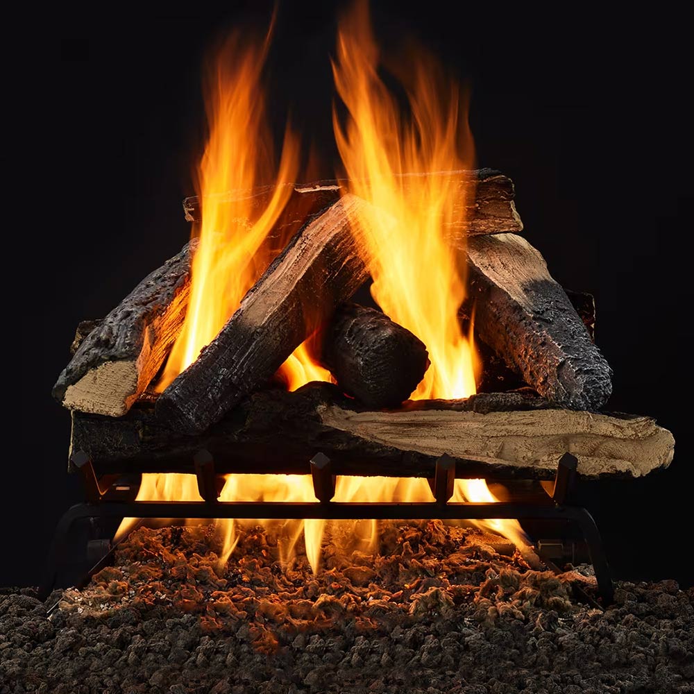 Indoor gas log set with glowing flames over stacked dark logs