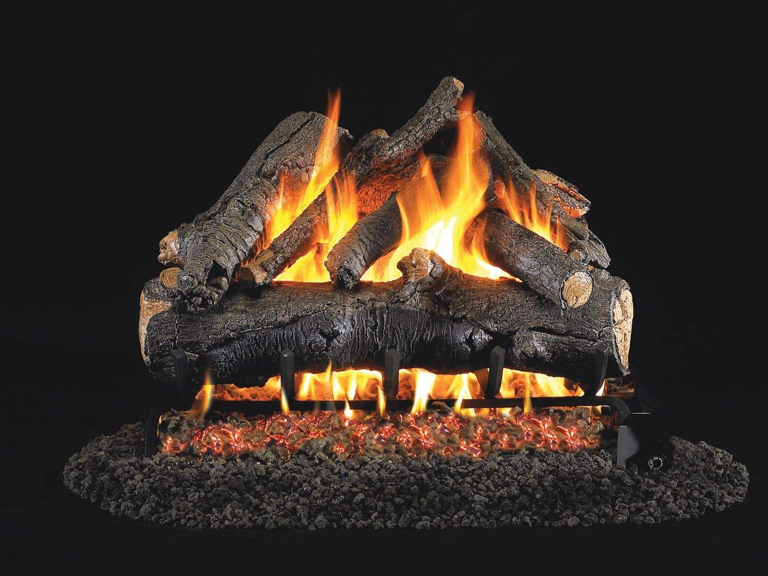 Vented gas log set with burning logs and glowing embers