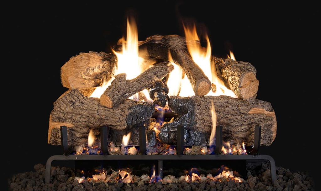 Charred angel oak vented gas log set with glowing flames in a metal grate