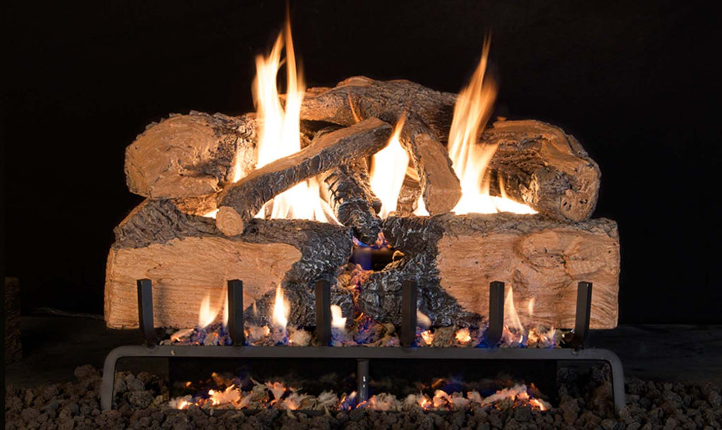 Charred split oak gas log set with glowing flames and dark vented firewood pieces
