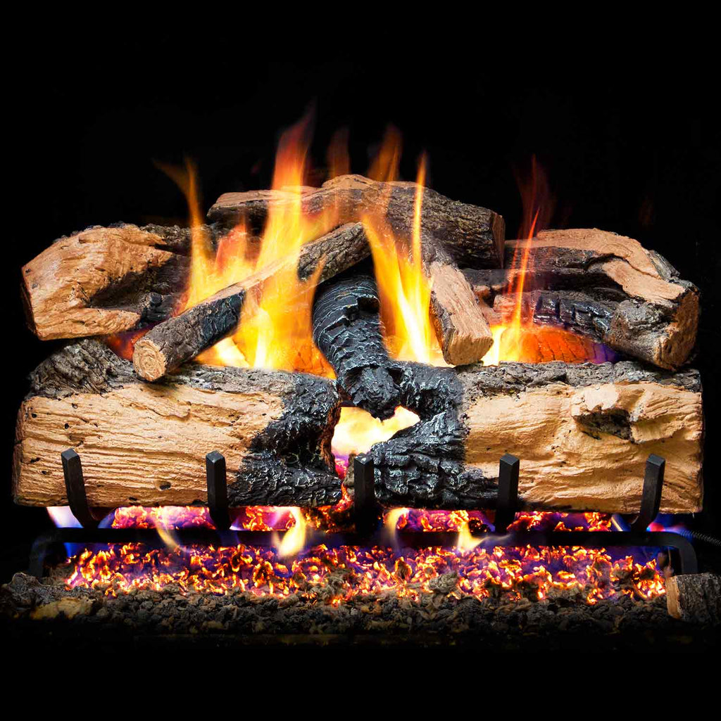 Charred split oak gas log set with glowing embers and flames