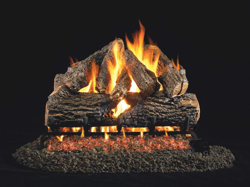 Charred oak vented gas log set with glowing flames and burner grate