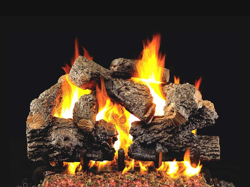 Vented gas log set with charred oak logs and active yellow flames
