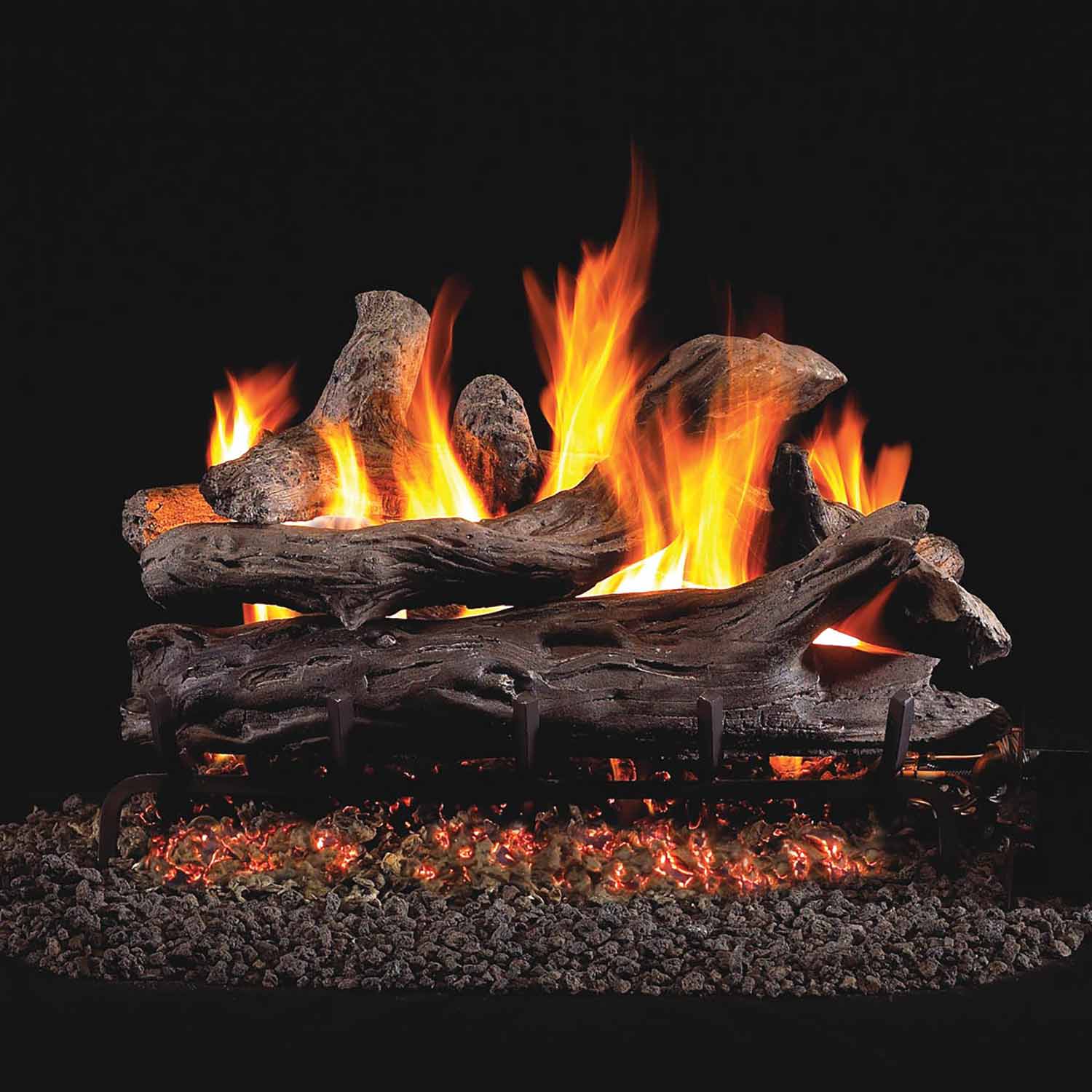 Vented gas log set with driftwood-style logs and glowing flames