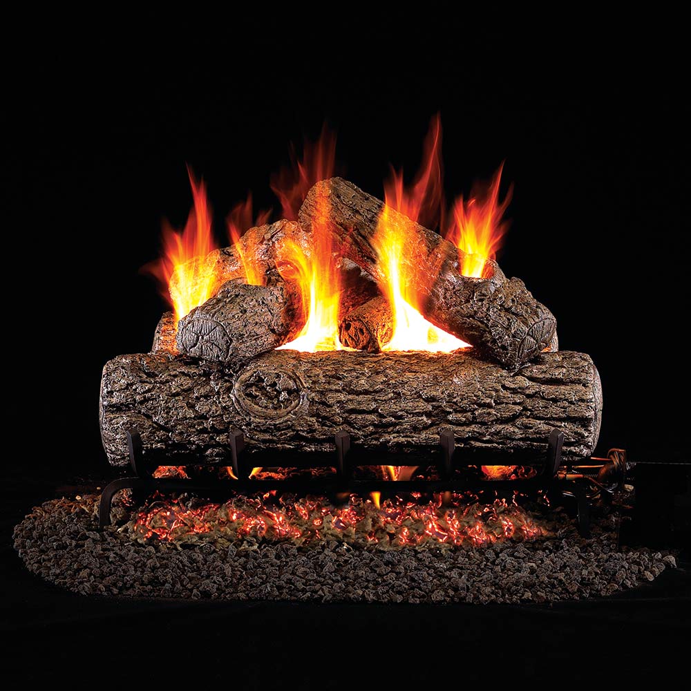 Vented gas log set with glowing embers and burning flames over dark logs