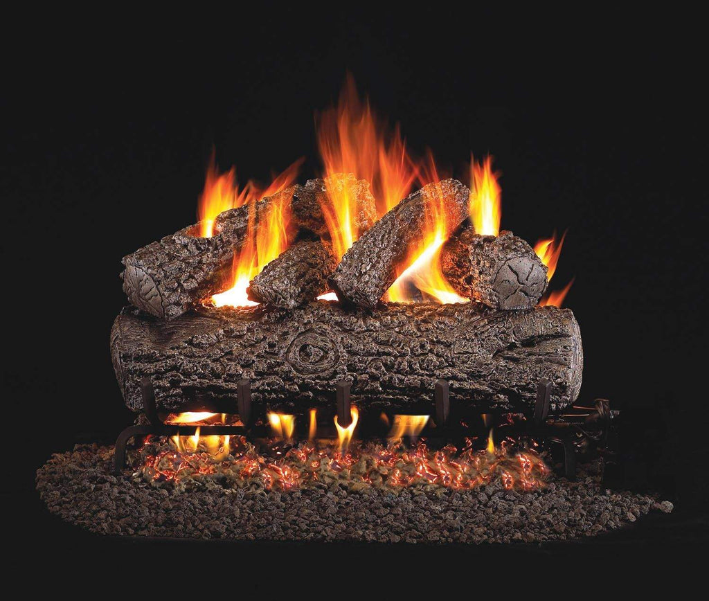 Vented oak gas log set with glowing flames on dark log bed