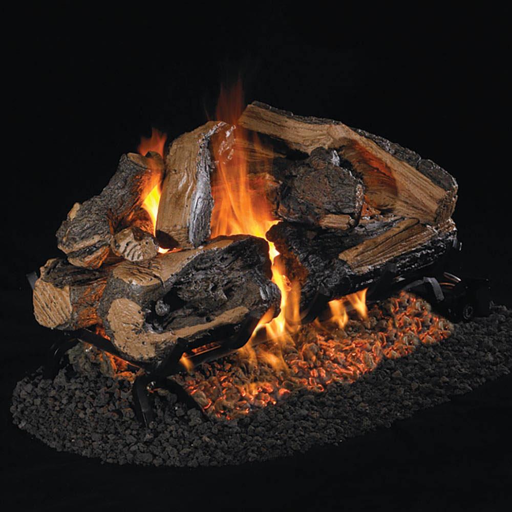 Charred vented gas log set with split oak logs and active flames