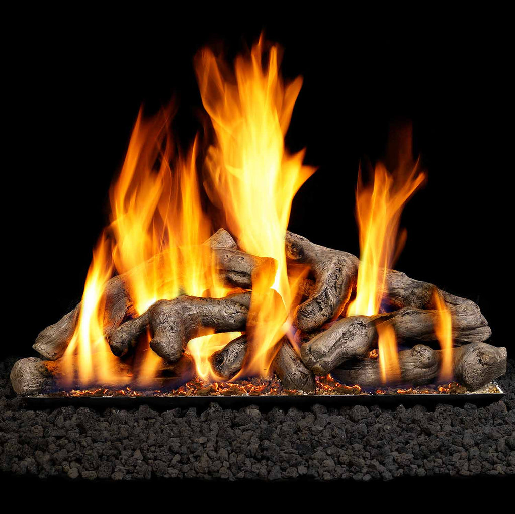 Vented gas log set with glowing flames over driftwood-style logs and embers