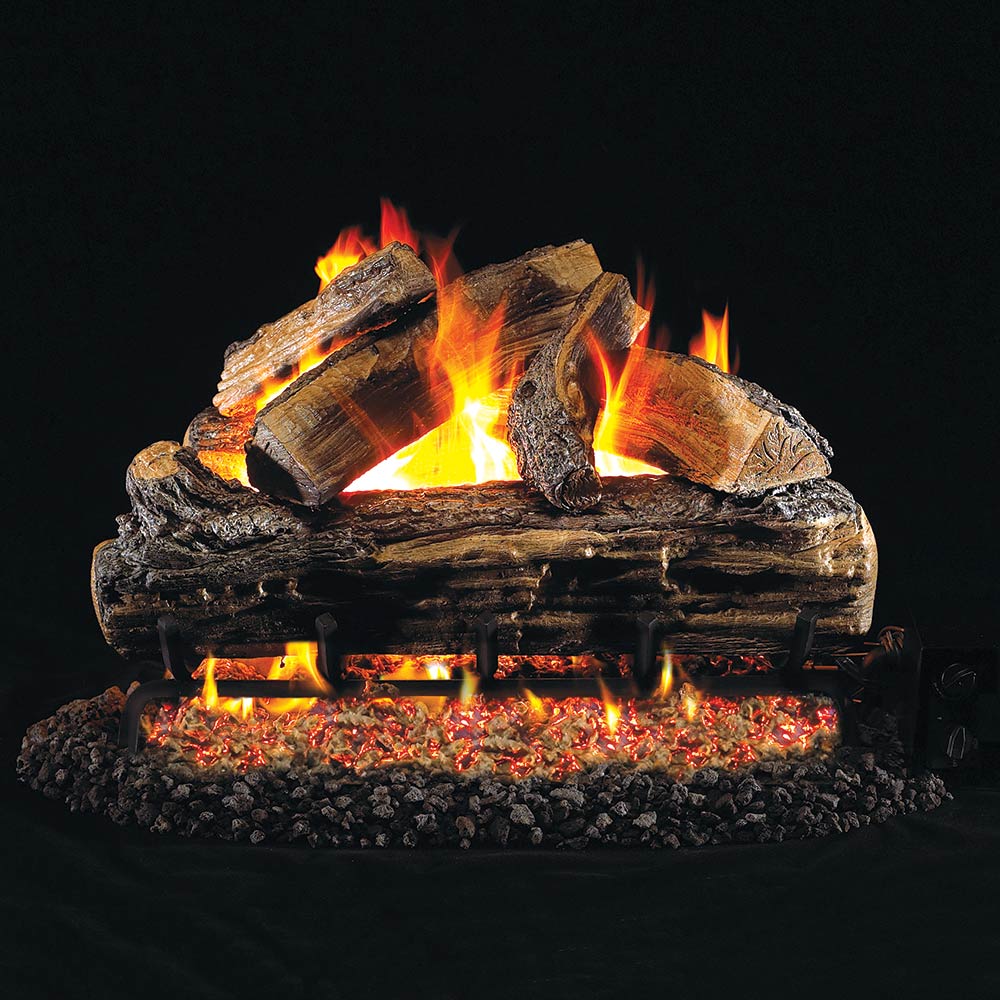 Vented gas log set with split oak logs burning flames over ember bed