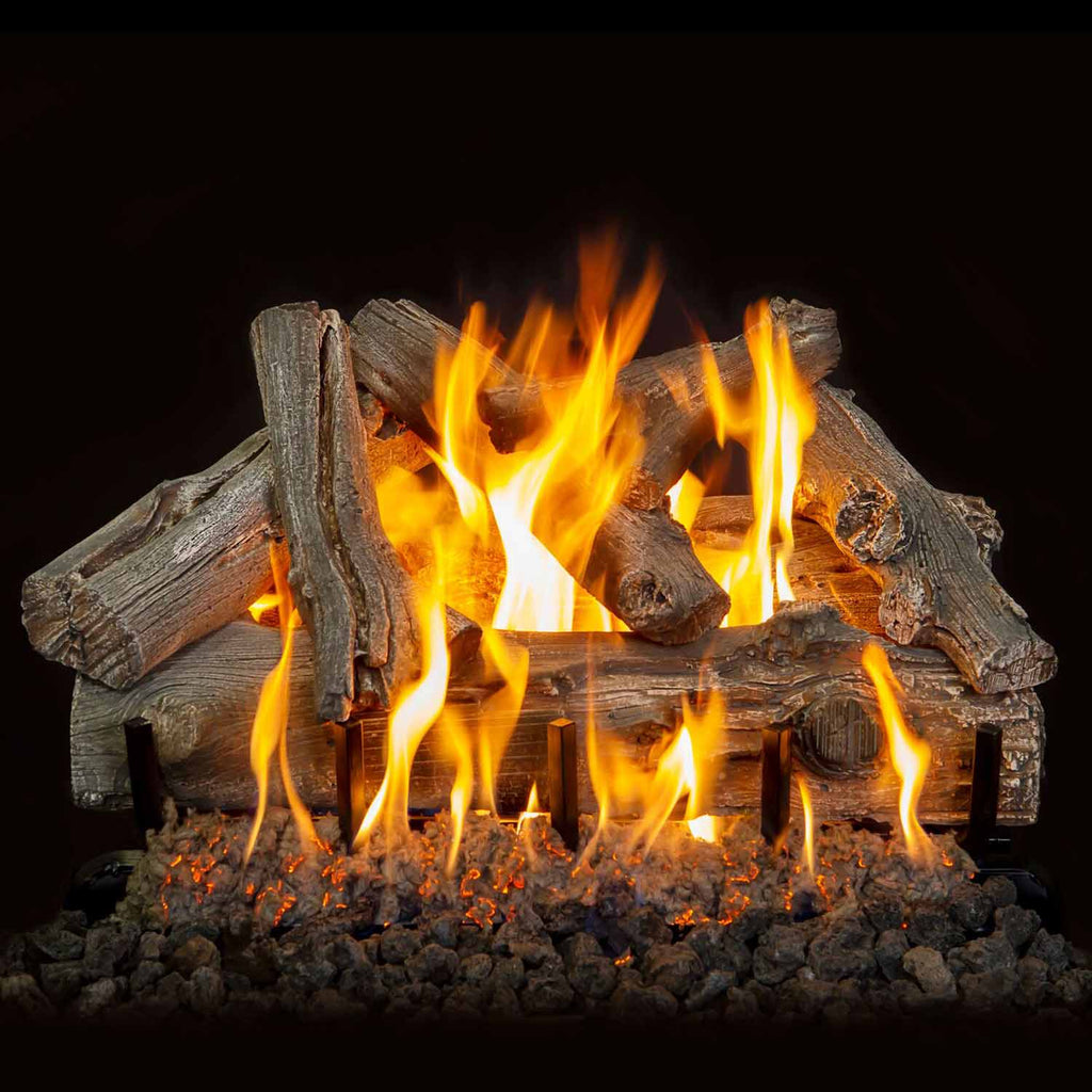 Vented gas log set with driftwood-style logs and bright orange flames