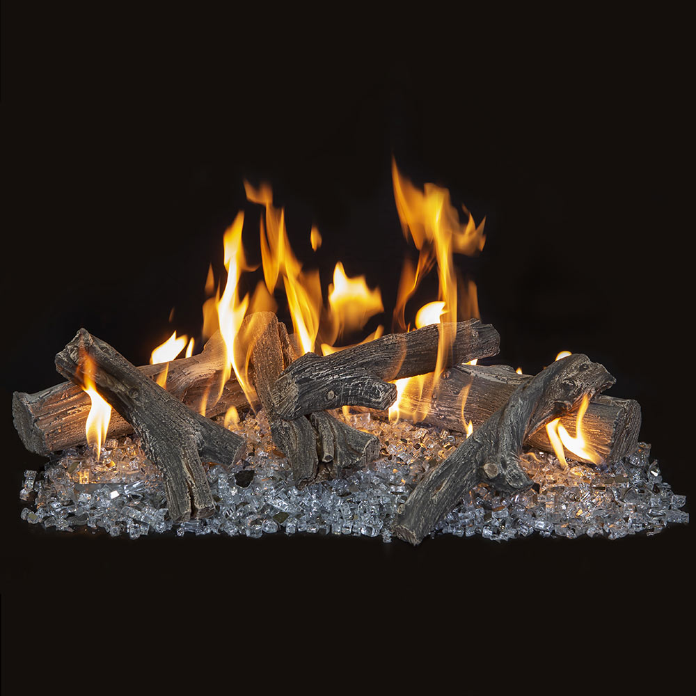 Vented gas log burner with dark logs and flames over gray glass media