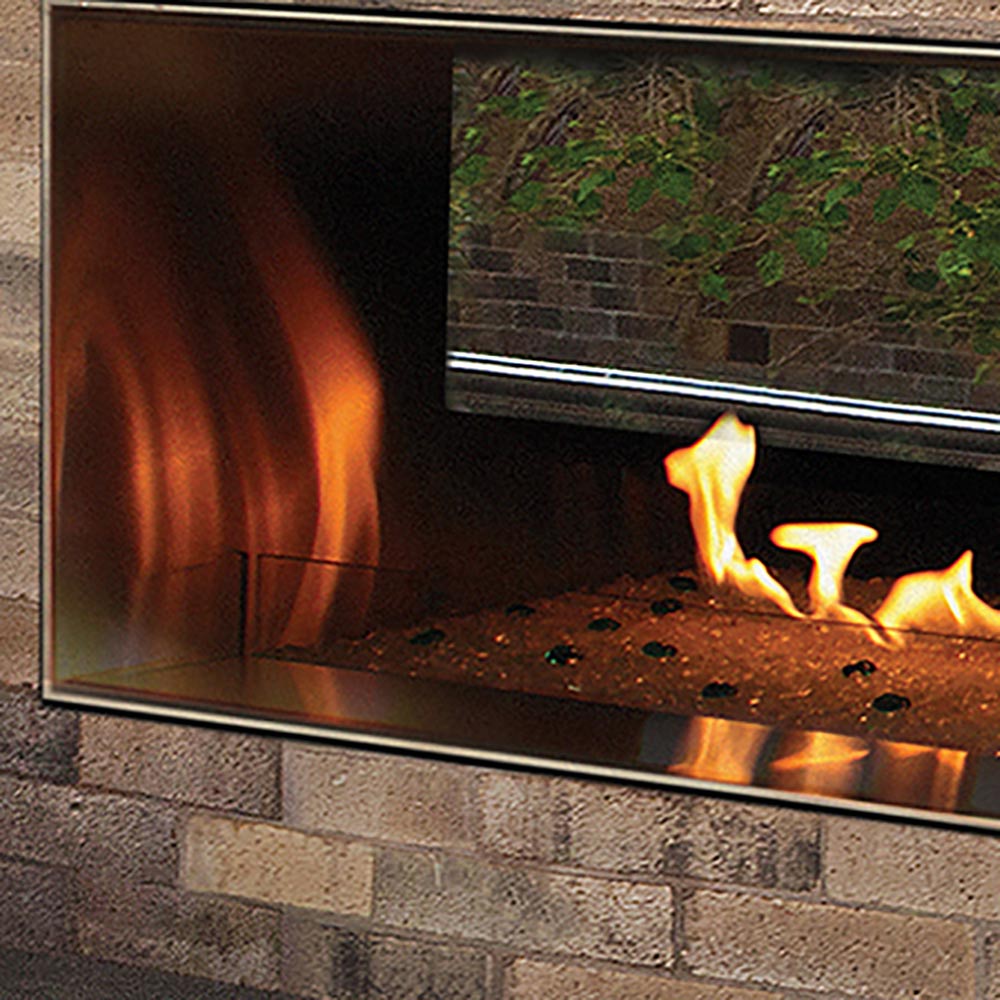 Outdoor linear fireplace glass wind guard with metal frame, flame view through clear glass