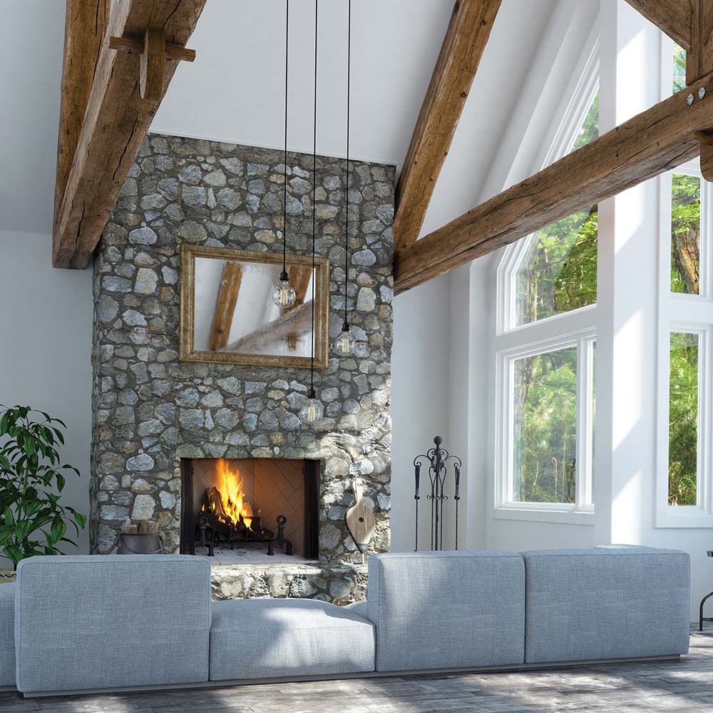 Wood-burning fireplace with stone surround and glowing fire in open hearth