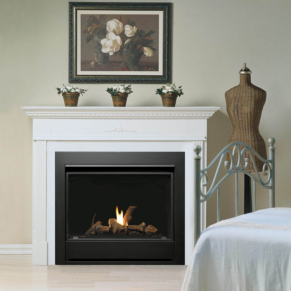 Zero clearance gas fireplace with log set, black frame and glass front with burning logs