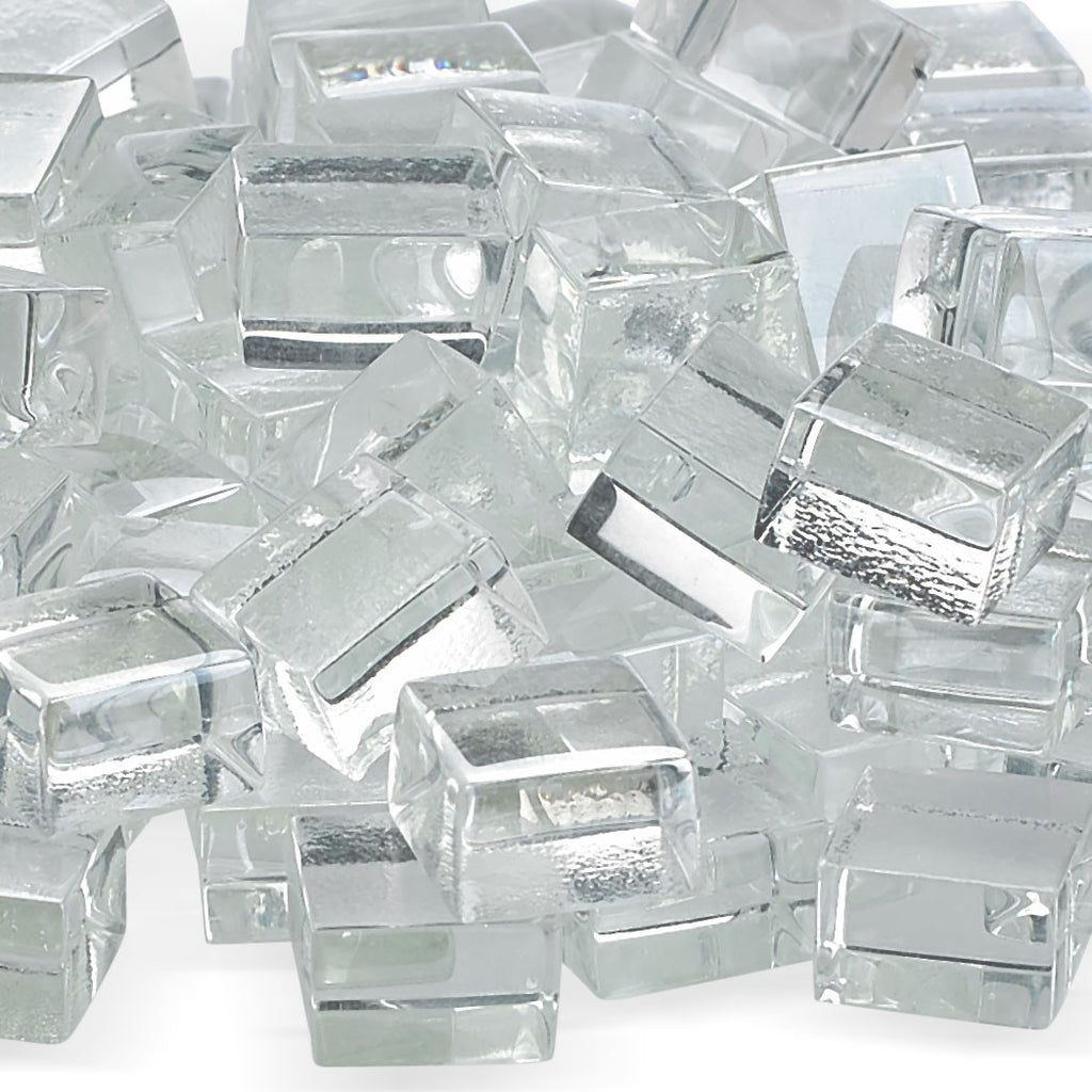 Clear fire glass cubes, close-up with reflective tops and faceted edges for fire pits