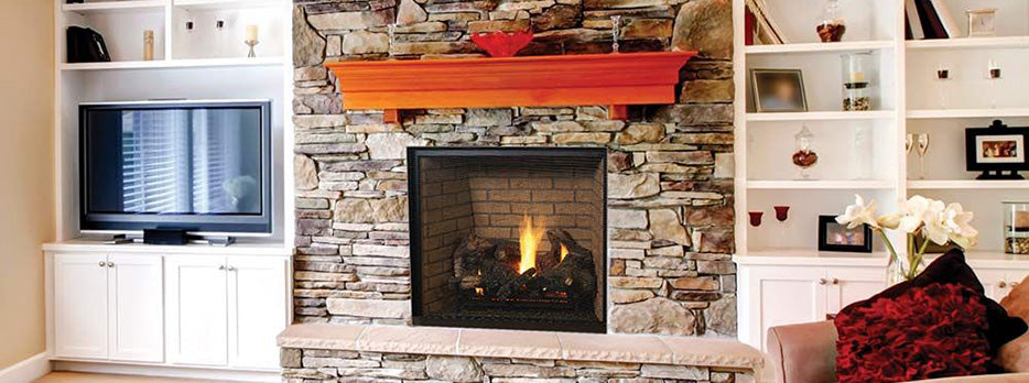 Direct vent gas fireplace with stone surround, burning logs, and mantel opening