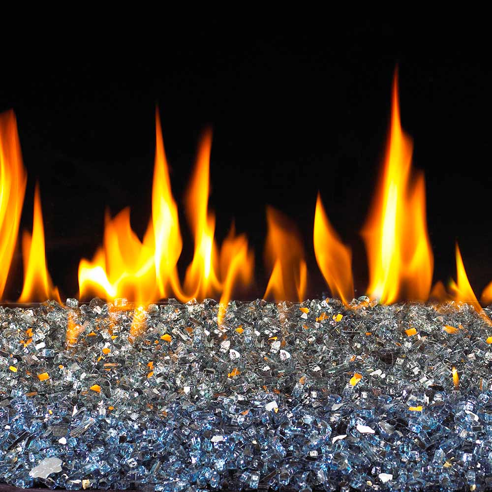 Reflective fire glass bed with bright flames and glowing embers