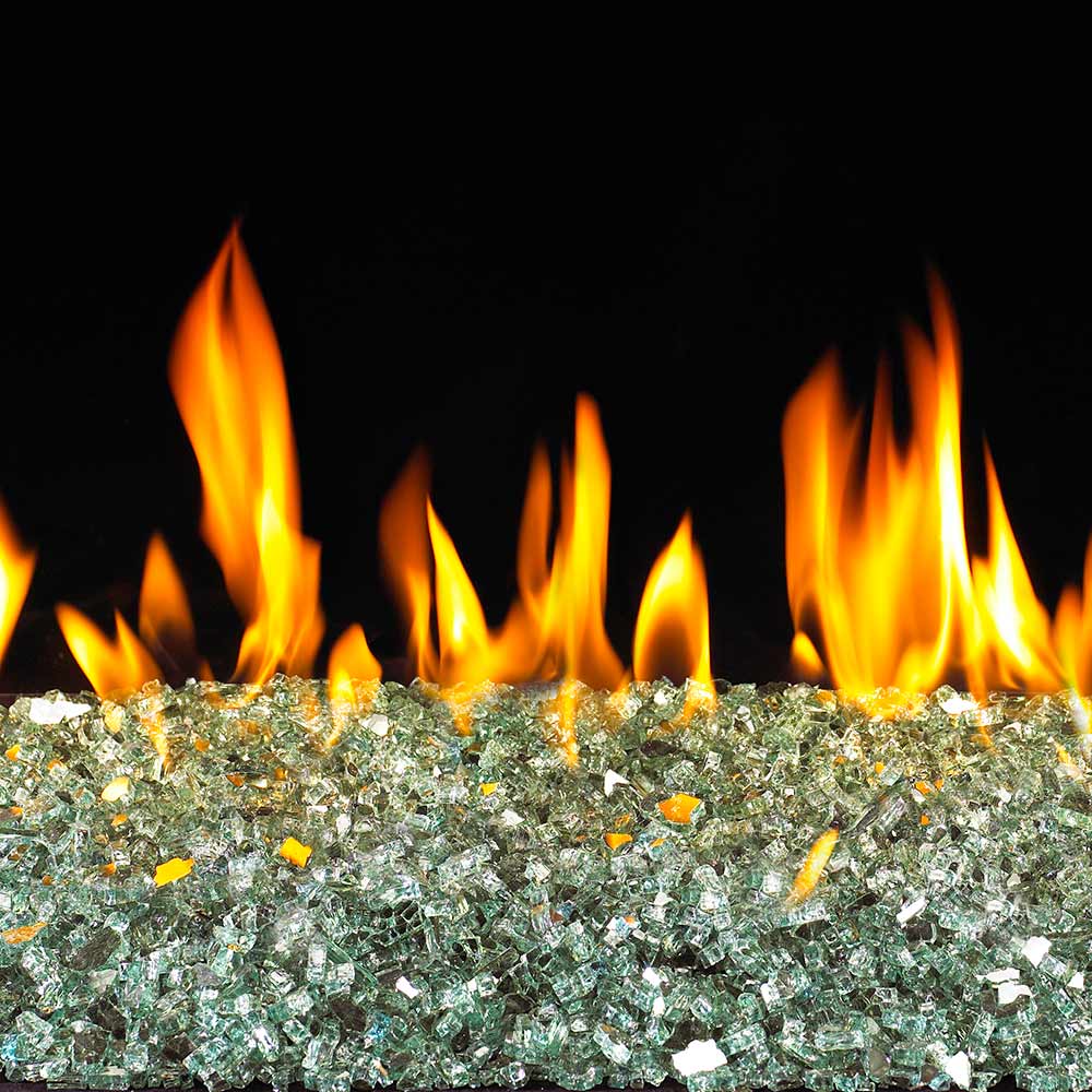 Reflective fire glass bed with emerald green pieces and flames